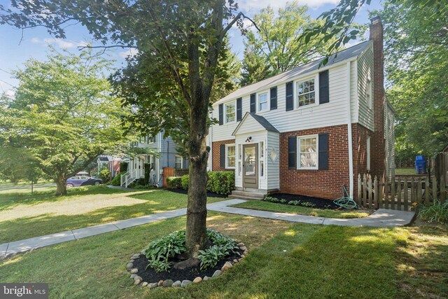 9215 Glenville Rd, Silver Spring, MD 20901 - colonial inspired home with brick siding and a chimney