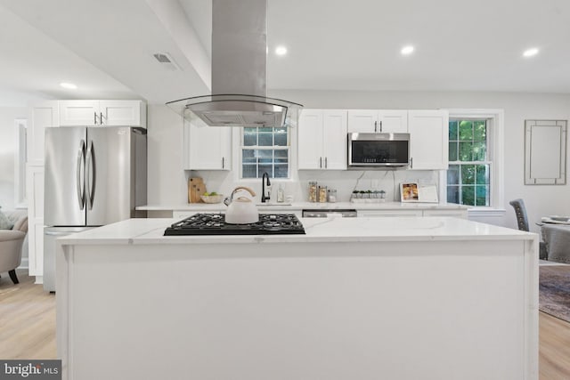9215 Glenville Rd, Silver Spring, MD 20901 - kitchen featuring island range hood, stainless steel appliances, white cabinetry, a center island, and light stone counters