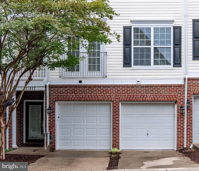 13812 Breezy Ridge Way Unit 101, Woodbridge, VA 22191 - view of front of home with a garage, driveway, and brick siding