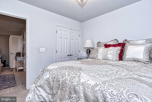 13812 Breezy Ridge Way Unit 101, Woodbridge, VA 22191 - bedroom featuring a closet and tile patterned flooring