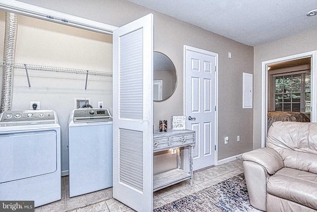 13812 Breezy Ridge Way Unit 101, Woodbridge, VA 22191 - laundry area featuring washer and dryer and tile patterned floors