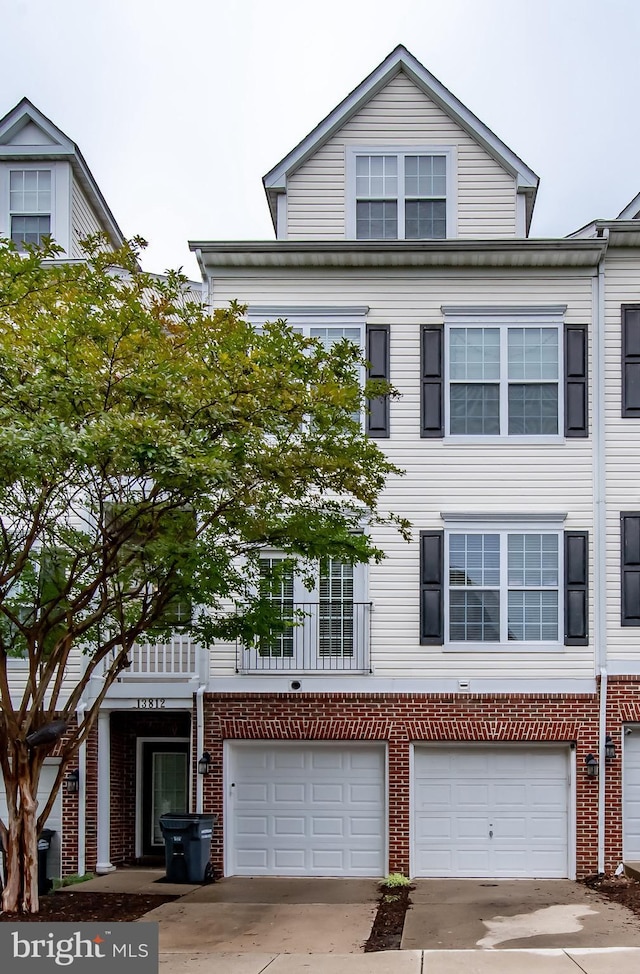 13812 Breezy Ridge Way Unit 101, Woodbridge, VA 22191 - townhome / multi-family property featuring an attached garage, driveway, and brick siding