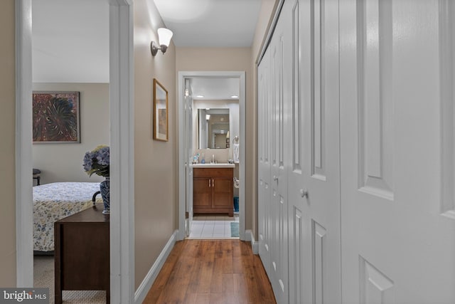 432 Old Forge Xing Unit 432, Devon, PA 19333 - hallway with dark wood finished floors and baseboards