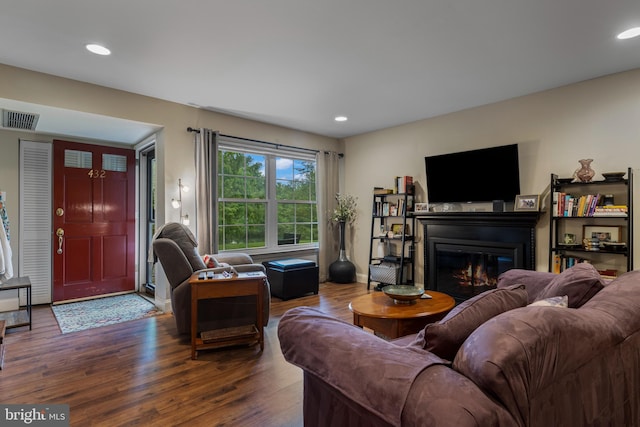432 Old Forge Xing Unit 432, Devon, PA 19333 - living room with dark wood-style floors, a glass covered fireplace, and recessed lighting
