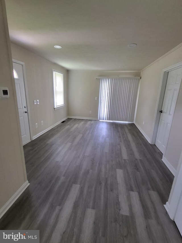 501 Tunstall Ave, Blackstone, VA 23824 - empty room with baseboards and dark wood-style floors
