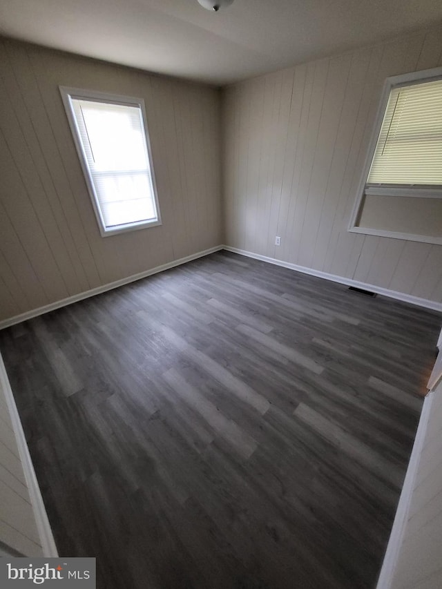 501 Tunstall Ave, Blackstone, VA 23824 - unfurnished room featuring dark wood-style floors and baseboards