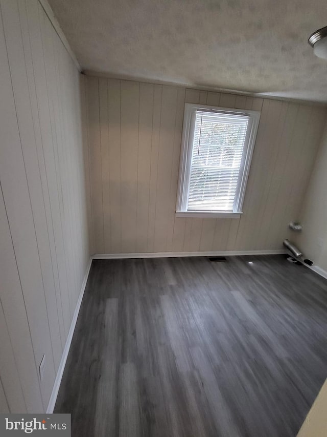 501 Tunstall Ave, Blackstone, VA 23824 - bonus room with dark wood finished floors and wooden walls