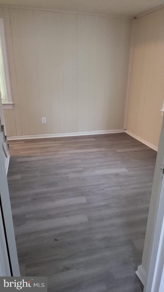 501 Tunstall Ave, Blackstone, VA 23824 - unfurnished room with wood finished floors and wooden walls