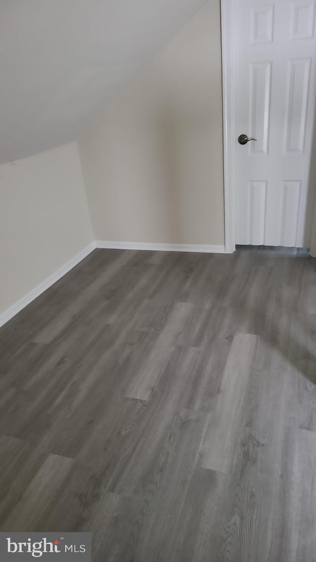 501 Tunstall Ave, Blackstone, VA 23824 - bonus room featuring dark wood-style flooring and vaulted ceiling