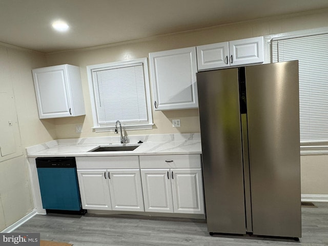 501 Tunstall Ave, Blackstone, VA 23824 - kitchen featuring stainless steel refrigerator, dishwashing machine, light wood-style floors, white cabinetry, and ornamental molding