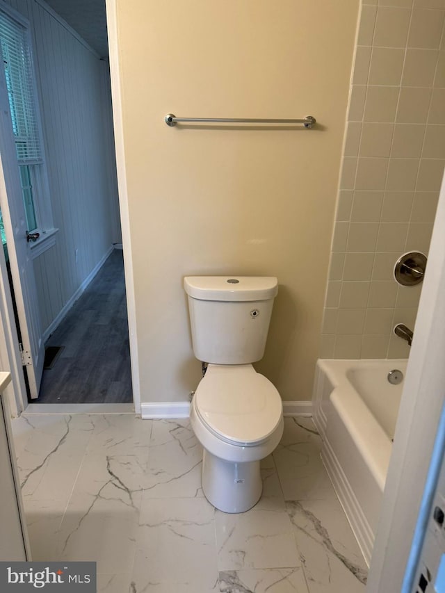 501 Tunstall Ave, Blackstone, VA 23824 - bathroom with marble finish floors and washtub / shower combination