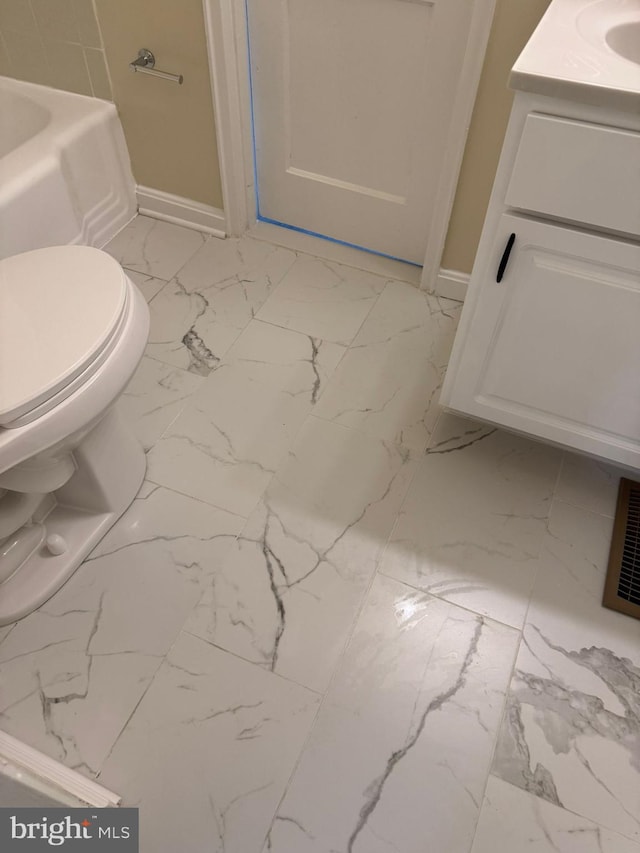 501 Tunstall Ave, Blackstone, VA 23824 - bathroom with marble look tile flooring and vanity