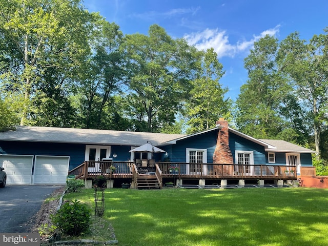 460 Pemberton Byp, Pemberton, NJ 08068 - view of front of house featuring french doors, a wooden deck, a front lawn, and a garage