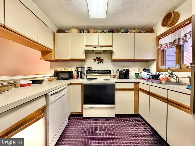 102 Tecumseh Trl, Hedgesville, WV 25427 - kitchen featuring white appliances, under cabinet range hood, light countertops, and a textured ceiling