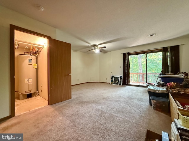 102 Tecumseh Trl, Hedgesville, WV 25427 - unfurnished living room with electric water heater, carpet, and a ceiling fan