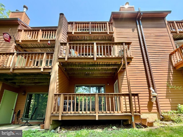 102 Tecumseh Trl, Hedgesville, WV 25427 - back of property with a balcony