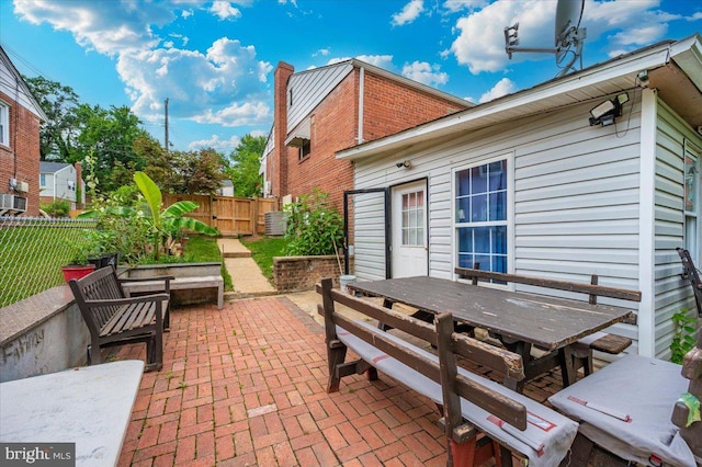6612 Stockton Ln, Hyattsville, MD 20784 - view of patio with outdoor dining area and a gate