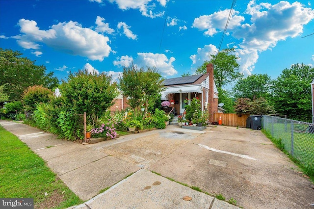 6612 Stockton Ln, Hyattsville, MD 20784 - view of front facade with roof mounted solar panels and a chimney