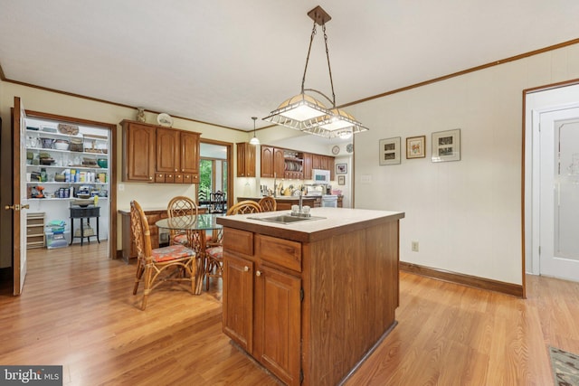 28 Cliff Rd, Front Royal, VA 22630 - kitchen with an island with sink, light wood-style floors, brown cabinetry, white microwave, and ornamental molding
