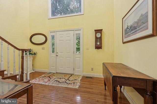 28 Cliff Rd, Front Royal, VA 22630 - entryway with a high ceiling, plenty of natural light, stairway, and hardwood / wood-style floors