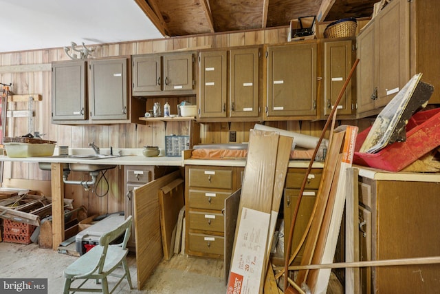 28 Cliff Rd, Front Royal, VA 22630 - kitchen with unfinished concrete floors, light countertops, wooden walls, and open shelves