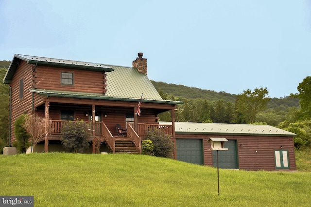 1870 General Potter Hwy, Centre Hall, PA 16828 - back of house with a chimney, a lawn, a metal roof, and a porch