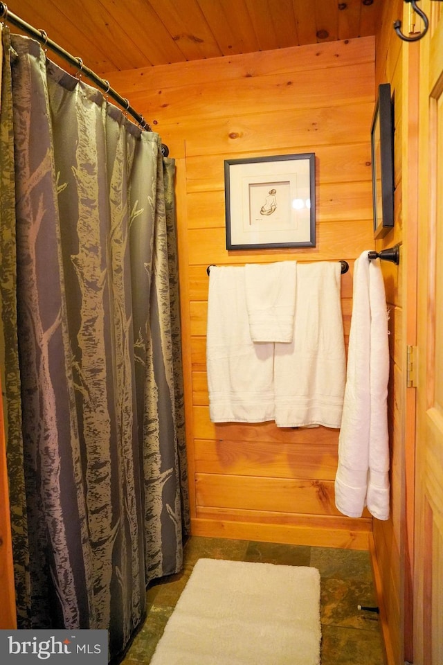 1870 General Potter Hwy, Centre Hall, PA 16828 - bathroom with wooden walls, wood ceiling, and a shower with shower curtain