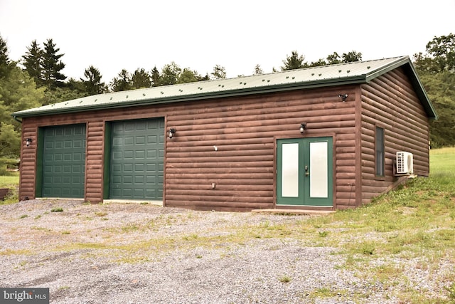 1870 General Potter Hwy, Centre Hall, PA 16828 - back of property with an outbuilding, log veneer siding, a garage, and a metal roof