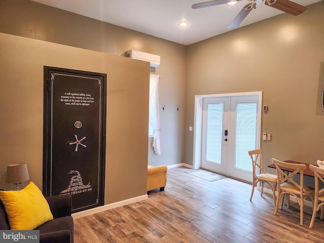 1870 General Potter Hwy, Centre Hall, PA 16828 - foyer with french doors, a ceiling fan, wood finished floors, a wall mounted air conditioner, and recessed lighting