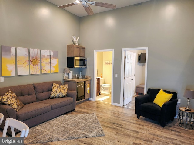 1870 General Potter Hwy, Centre Hall, PA 16828 - living room featuring a high ceiling, light wood-style floors, and ceiling fan
