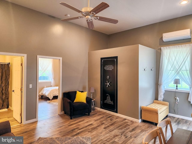 1870 General Potter Hwy, Centre Hall, PA 16828 - living area with an AC wall unit, wood finished floors, ceiling fan, healthy amount of natural light, and recessed lighting