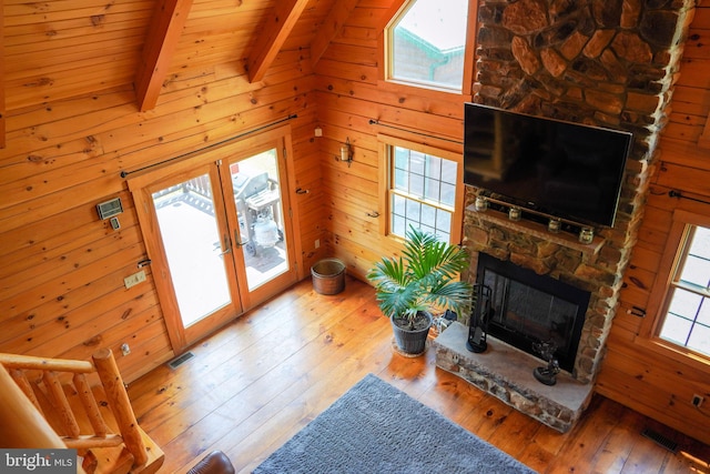 1870 General Potter Hwy, Centre Hall, PA 16828 - unfurnished living room with hardwood / wood-style floors, a fireplace, a wood ceiling with exposed beams, and wood walls