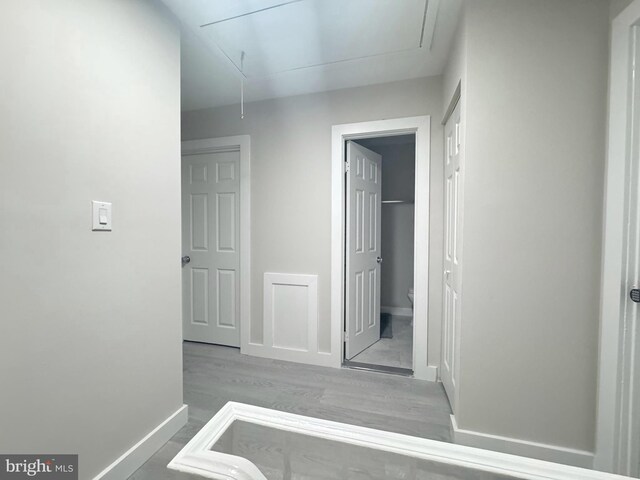 10105 Irongate Way, Manassas, VA 20109 - hallway featuring attic access and wood finished floors
