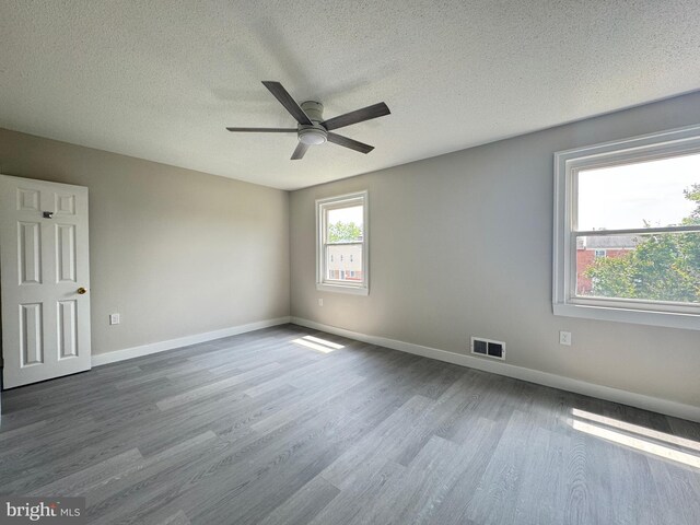 10105 Irongate Way, Manassas, VA 20109 - empty room with dark wood-style flooring, a ceiling fan, and a textured ceiling