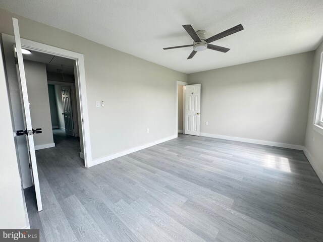 10105 Irongate Way, Manassas, VA 20109 - empty room with a ceiling fan and wood finished floors
