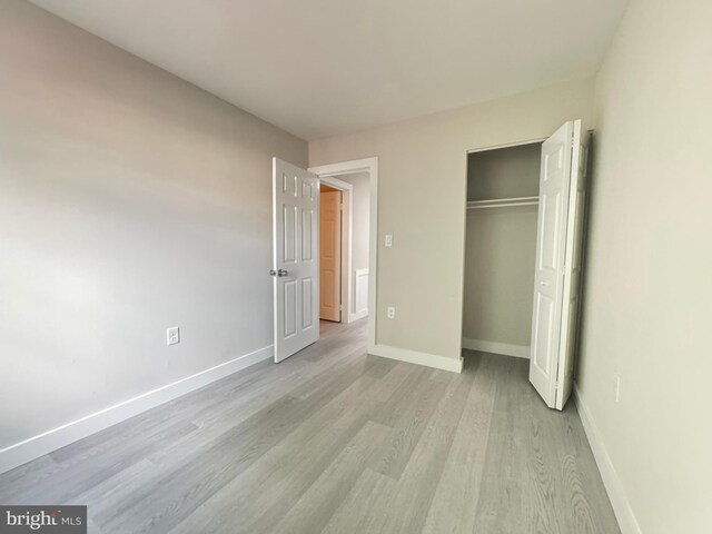 10105 Irongate Way, Manassas, VA 20109 - unfurnished bedroom with light wood-style floors and a closet