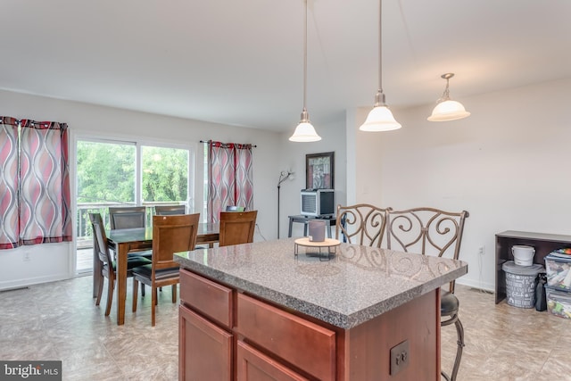 45 Private Ct, Bunker Hill, WV 25413 - kitchen featuring a breakfast bar area, a center island, and decorative light fixtures