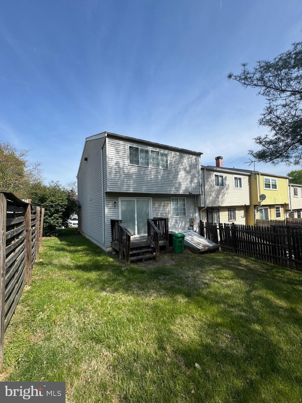 408 Possum Ct, Capitol Heights, MD 20743 - rear view of property with a fenced backyard and a deck