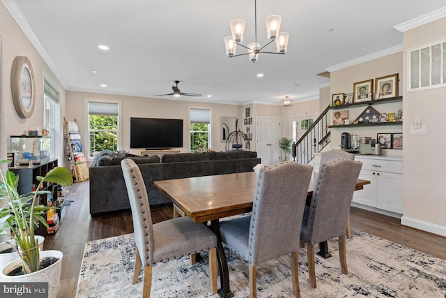 12123 Riverview Dr, Newburg, MD 20664 - dining space with wood finished floors, stairway, crown molding, a chandelier, and ceiling fan