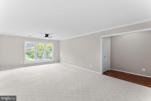 1003 Foxhunt Ter NE Unit 201, Leesburg, VA 20176 - spare room featuring ornamental molding, ceiling fan, and carpet flooring