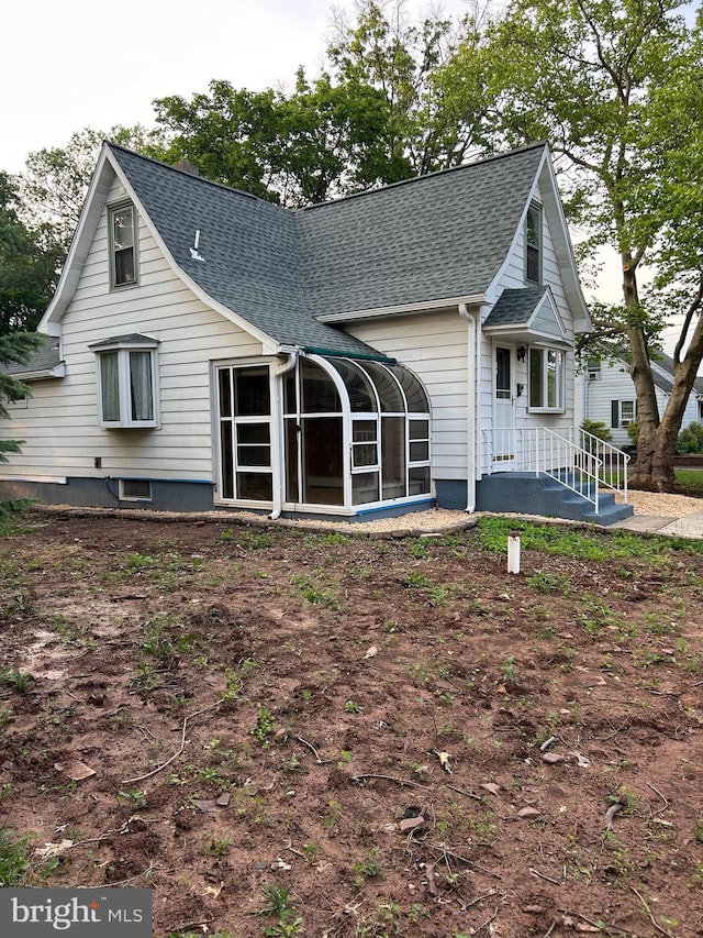 524 W Orvilla Rd, Hatfield, PA 19440 - back of property with a shingled roof and a sunroom