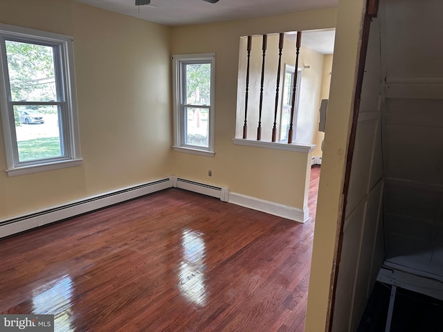 524 W Orvilla Rd, Hatfield, PA 19440 - empty room featuring wood finished floors, a ceiling fan, and baseboard heating