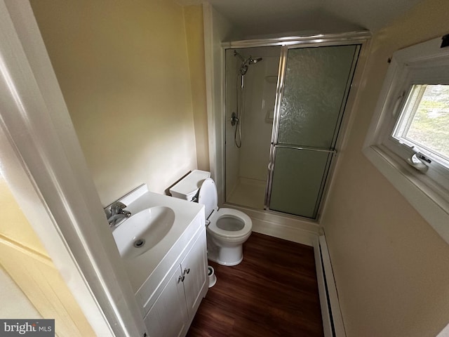 524 W Orvilla Rd, Hatfield, PA 19440 - full bathroom with baseboard heating, a stall shower, vanity, and wood finished floors