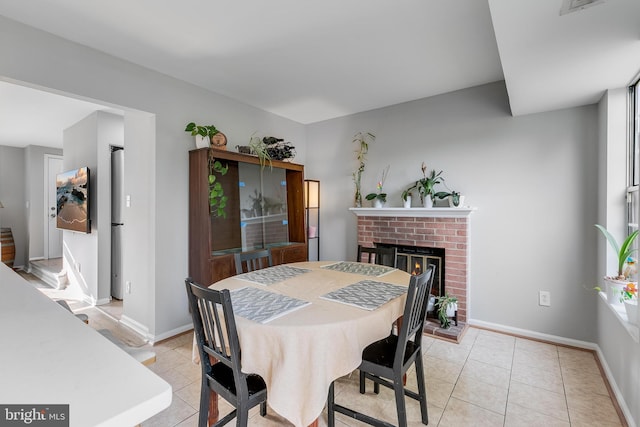 196 Saint Johns Sq, Sterling, VA 20164 - dining space featuring a fireplace and light tile patterned floors