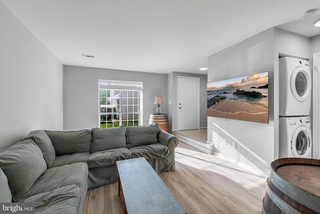 196 Saint Johns Sq, Sterling, VA 20164 - living area with stacked washer and clothes dryer, light wood-style flooring, and recessed lighting