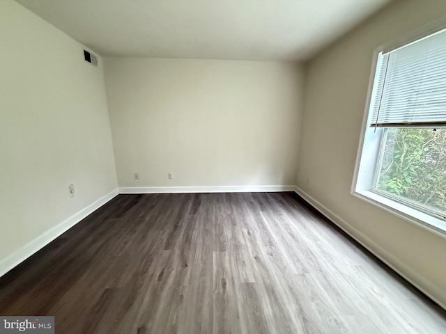 3179 Summit Square Dr Unit 2-B5, Oakton, VA 22124 - empty room featuring dark wood-type flooring and baseboards