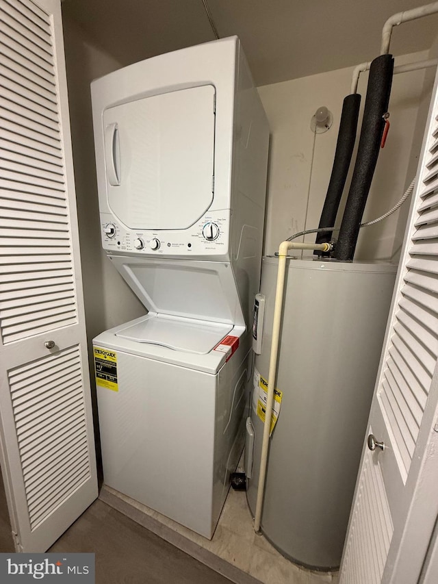 3179 Summit Square Dr Unit 2-B5, Oakton, VA 22124 - laundry area with stacked washer / dryer and electric water heater