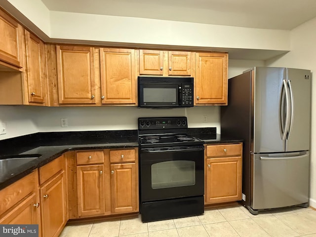3179 Summit Square Dr Unit 2-B5, Oakton, VA 22124 - kitchen with black appliances, light tile patterned floors, brown cabinets, and dark stone countertops
