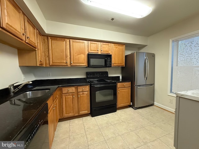 3179 Summit Square Dr Unit 2-B5, Oakton, VA 22124 - kitchen with black appliances, brown cabinetry, and light tile patterned floors