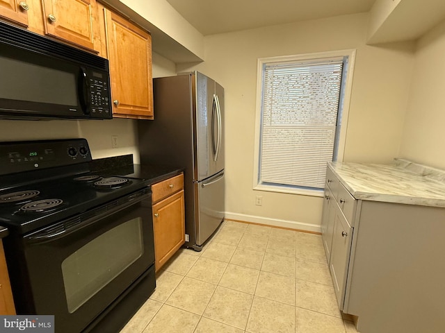 3179 Summit Square Dr Unit 2-B5, Oakton, VA 22124 - kitchen with black appliances, light tile patterned flooring, and brown cabinets